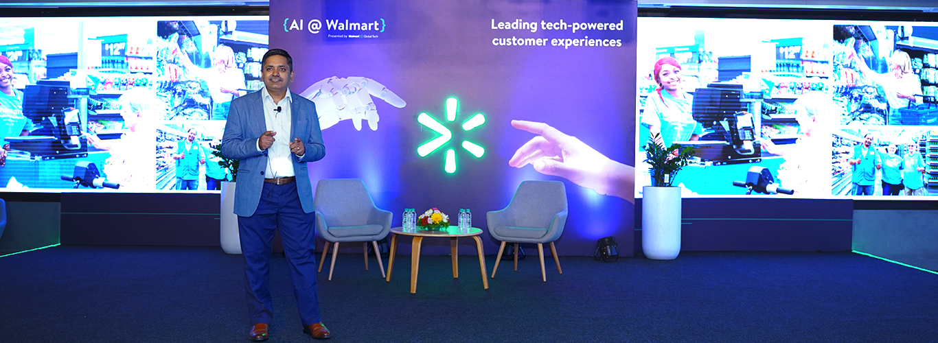Balu Chaturvedula, SVP & Country Head, Walmart Global Tech standing on stage at AI @ Walmart 2024.