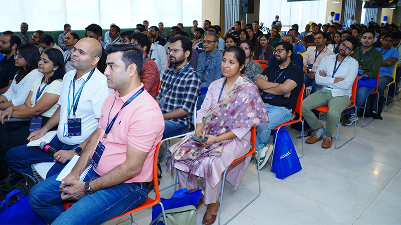 A wide shot of audience members at AI @ Walmart. 