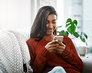 Image shows a customer on their phone.