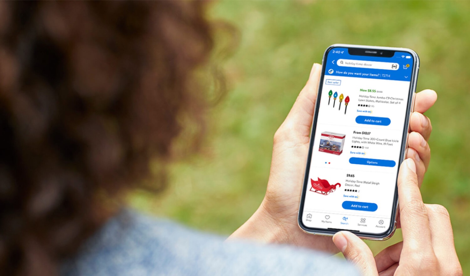 An individual scrolling through different products via the Walmart app.